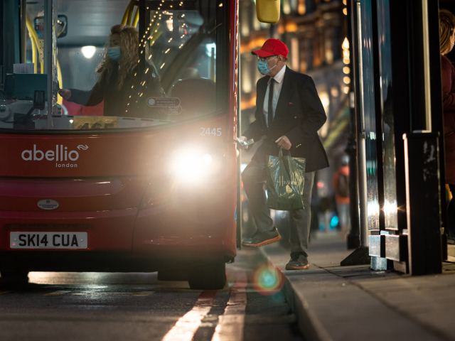 Man boarding a bus