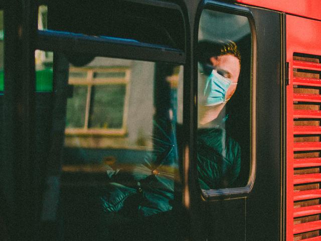 Man in face mask on bus