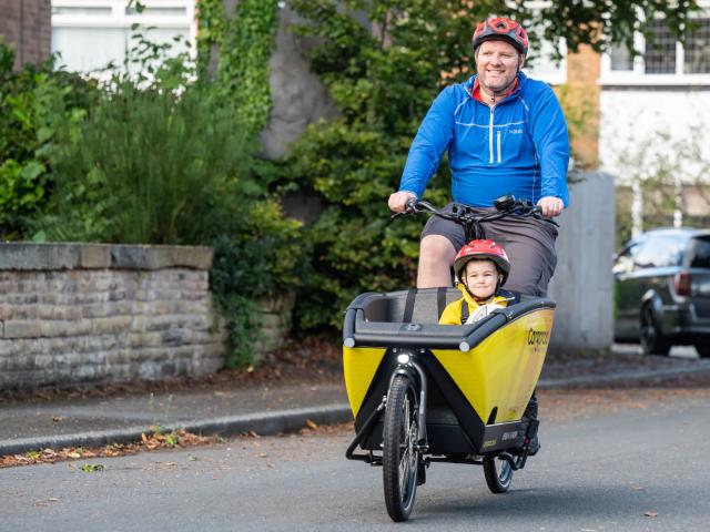 Man and boy on cargo bike